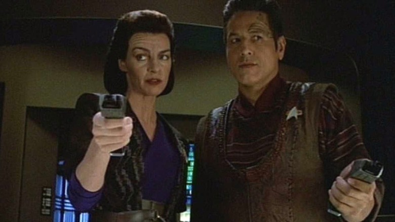 Seska and Chakotay holding phasers in "Star Trek: Voyager"