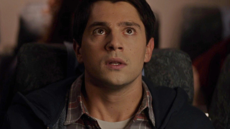 Sam looking up in the airplane in "Final Destination 5" (2011)