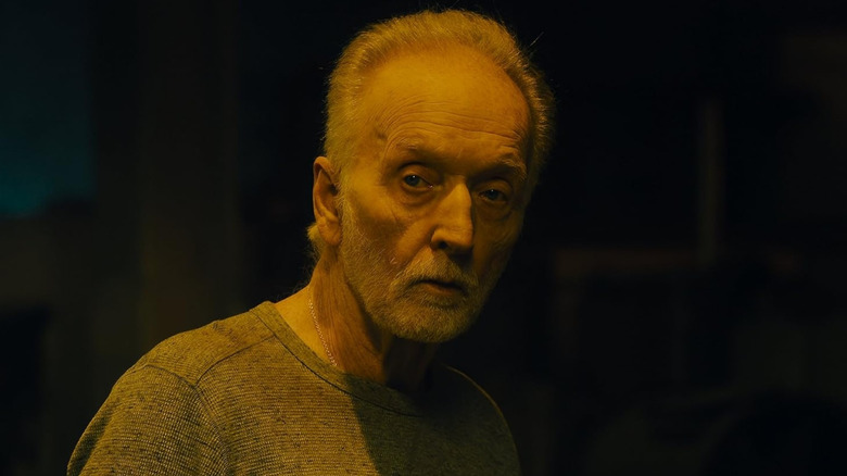 John Kramer looking at his trap victims in "Saw X" (2023)