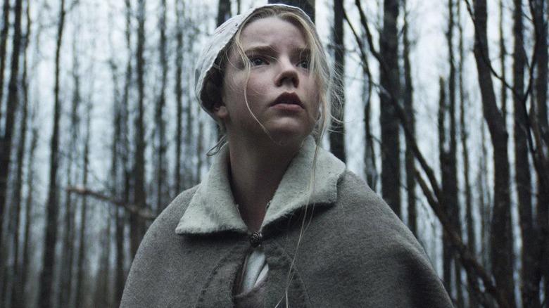 Thomasin looks up in the woods in The Witch (2015)