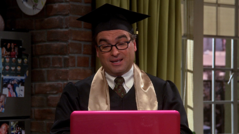 Leonard in a cap and gown talking to a computer in The Big Bang Theory (2007)