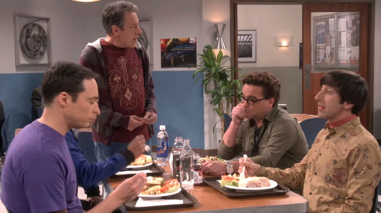 Kripke standing over a table with Sheldon, Leonard, and Howard on The Big Bang Theory (2007)