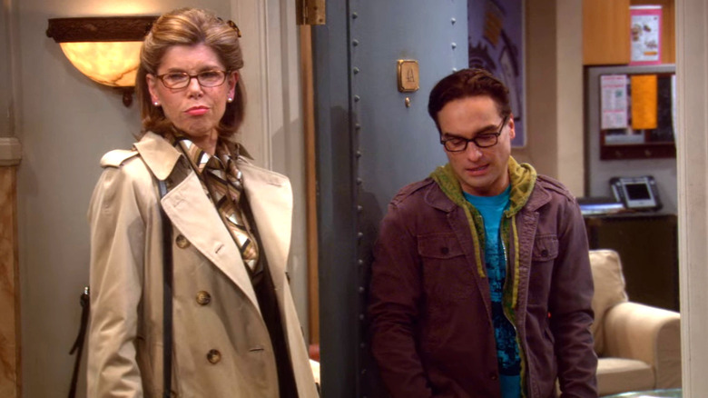 Beverly and Leonard standing outside his apartment in The Big Bang Theory (2007)