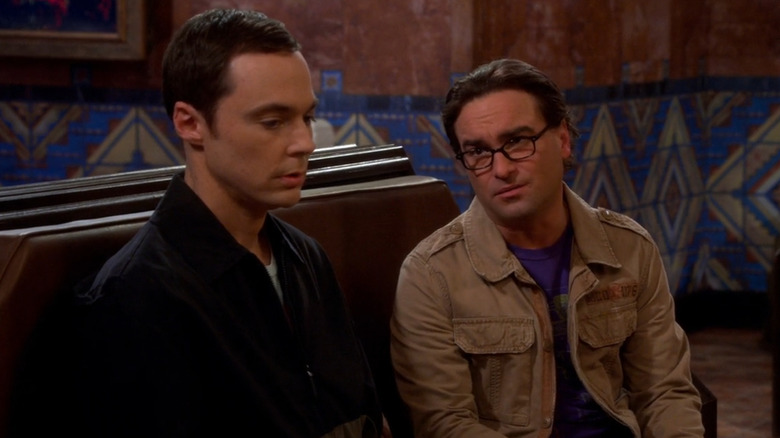 Leonard talking to Sheldon in a train station in The Big Bang Theory (2007)