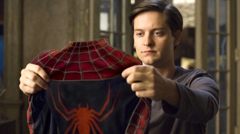 Peter Parker soaking in his Spider-Man outfit in 