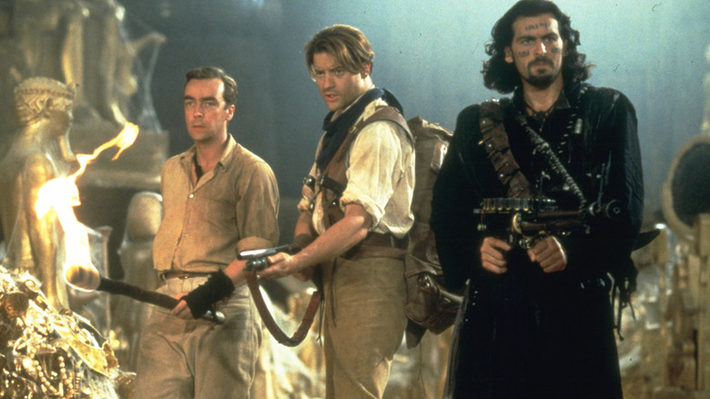 Jonathan, Rick, and Ardeth surrounded by gold in The Mummy (1999)