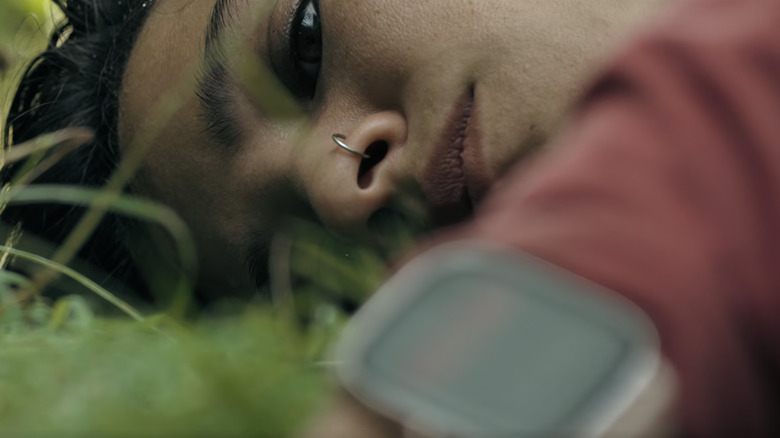 Iris lying in grass in Don't Move