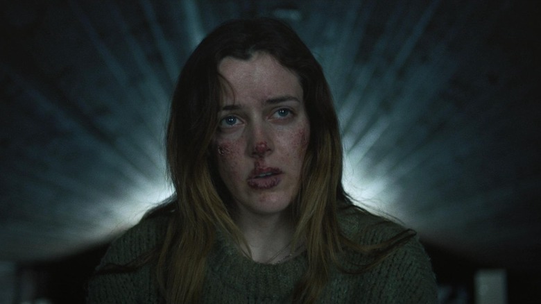 Grace Marshall looking bloodied in The Lodge