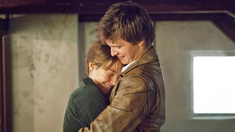 Hazel and Augustus hugging in "The Fault in Our Stars" (2014)