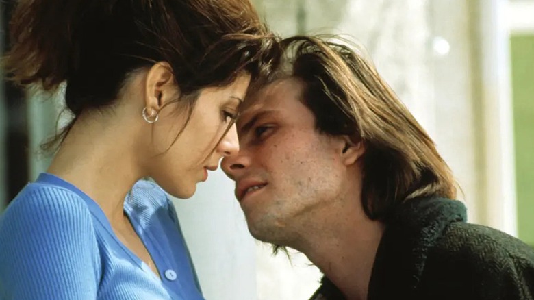 Adam leaning in to kiss Caroline in "Untamed Heart" (1993)