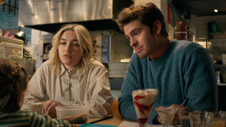 Almut and Tobias sitting at a table in "We Live in Time" (2024)