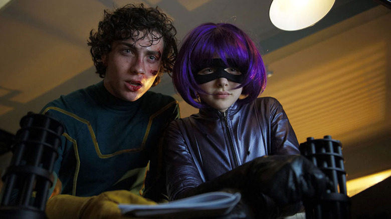 Kick-Ass and Hit Girl look down a shaft in Kick-Ass