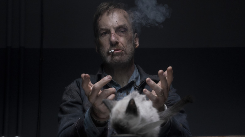 Hutch sits in an interrogation room smoking a cigarette in Nobody