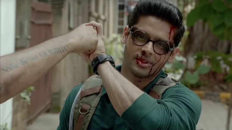 Surya hlds back a punch in The Man Who Feels No Pain