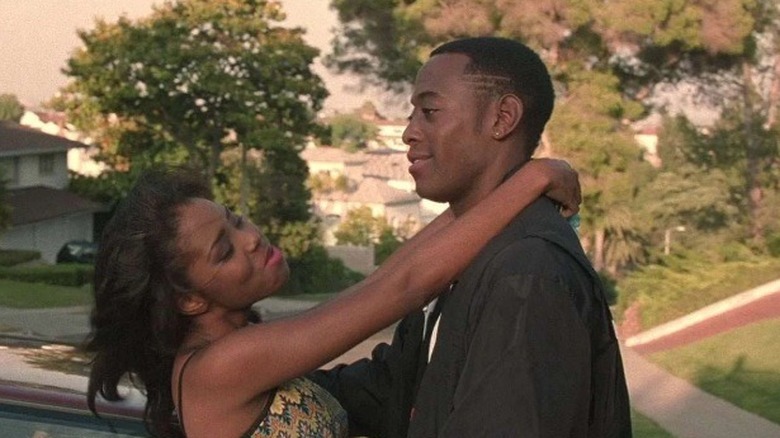 Monica with arms around Quincy's neck in Love & Basketball (2000)
