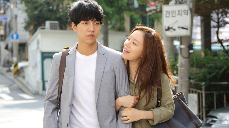Hyun-woo hangs on the arm of Joon-soo in Love Forecast (2015)