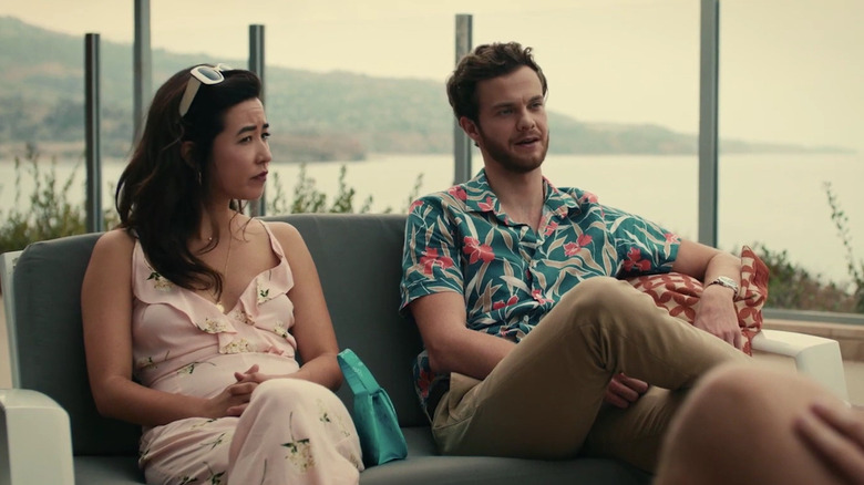 Ben talks while sitting next to Alice on a couch in Plus One (2019)