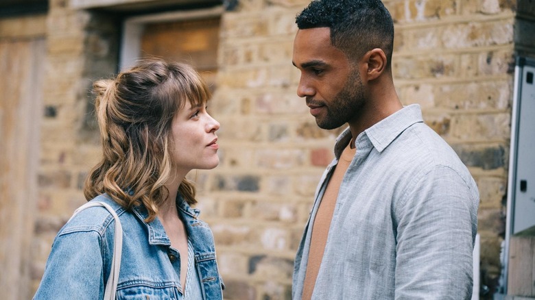 Minnie and Quinn looking at each other in This Time Next Year (2024)