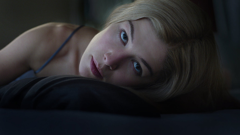 Amy leaning her head to look at Nick in Gone Girl