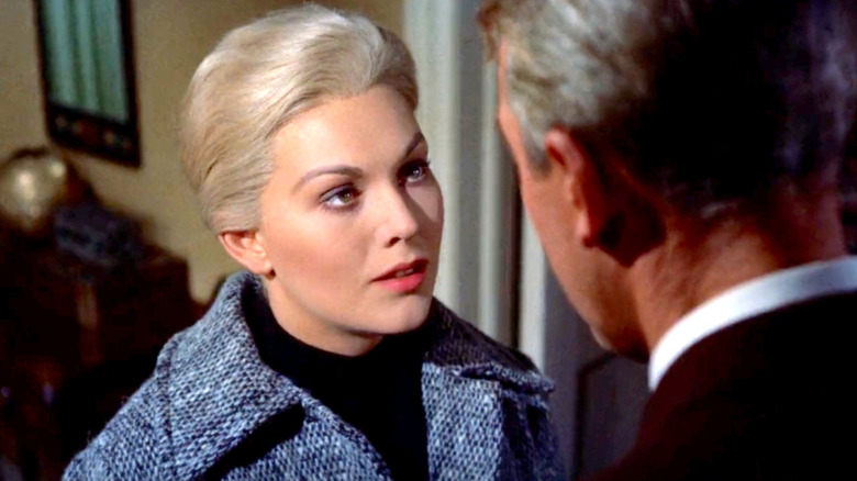 Madeleine looking up at Scottie curiously in Vertigo