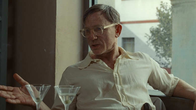 William Lee next to martini glasses in "Queer"
