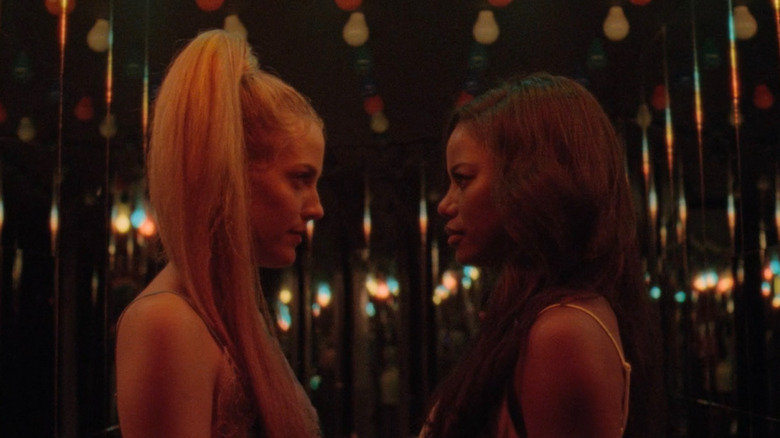 Stefani and Zola staring at each other in "Zola"