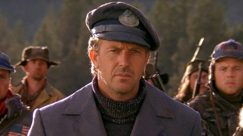 The Postman frowning in "The Postman."