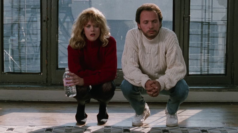 Sally and Harry squatting on his living room floor in When Harry Met Sally