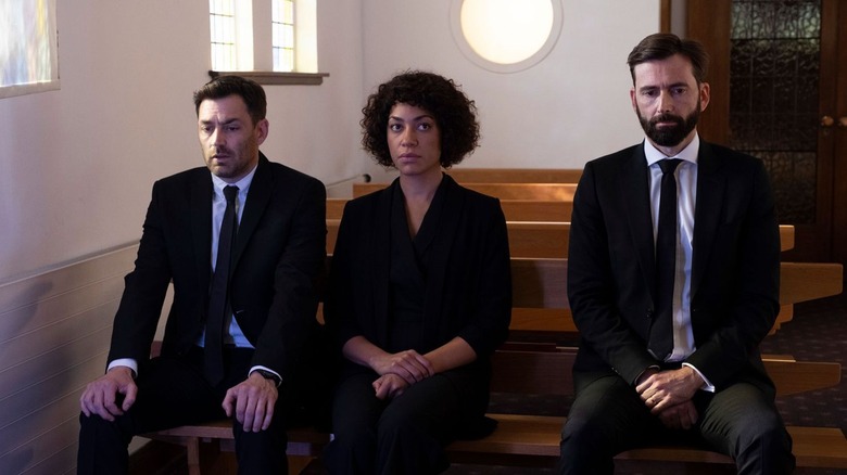 Tom, Jess, and Steve sit in church in Deadwater Fell