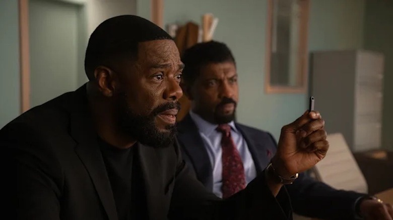 Muncie sits in an office and tries to explain himself in The Madness.