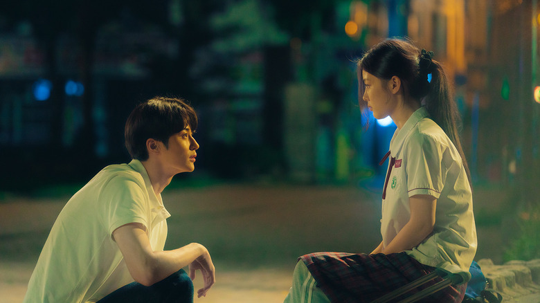 A tender moment between potential lovers in 20th Century Girl (2022)