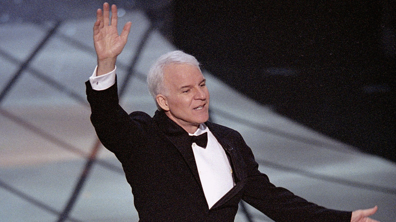 Steve Martin gesturing while hosting the Oscars