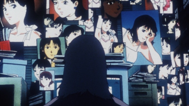 Me-Mania stares at photos of Mima on the wall in "Perfect Blue" (1997)