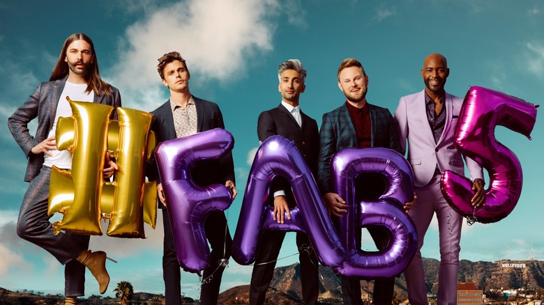 Jonathan, Antoni, Tan, Bobby, and Karamo in a promo image for "Queer Eye," holding balloons that spell "#FAB5"