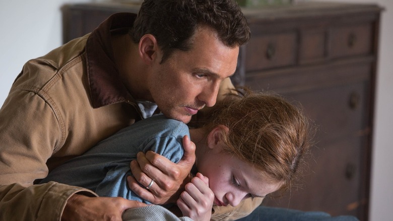 Cooper cradling a young Murph in "Interstellar" (2014)