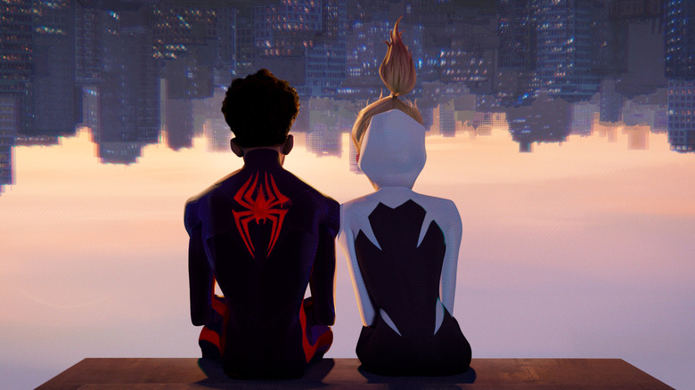 Miles and Gwen hang upside down above the NYC skyline in "Spider-Man: Across the Spider-Verse" (2023)