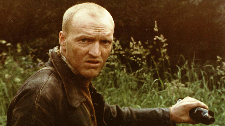 The Stalker holding bottle in "Stalker" (1979)