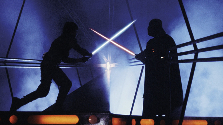 Luke and Darth Vader cross lightsabers in "The Empire Strikes Back" (1980)