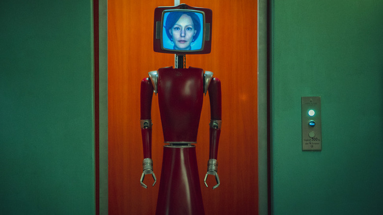 Cassandra coming off an elevator in Cassandra (2025)