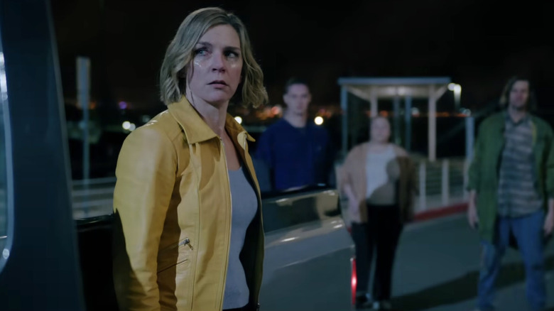 Carol crying with people in the background in Pluribus (2025)