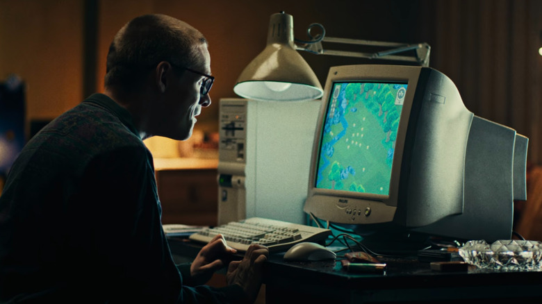 Cameron playing a video game with Thronglets in "Black Mirror"