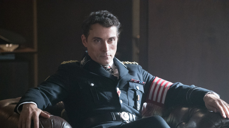 John Smith sits in uniform in The Man in the High Castle