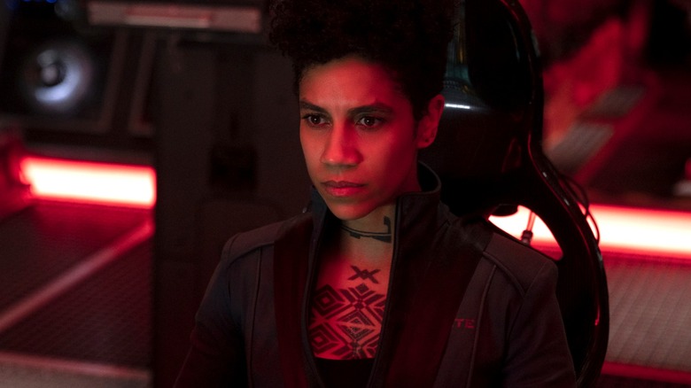 Naomi Nagata sitting in a space ship chair in "The Expanse"