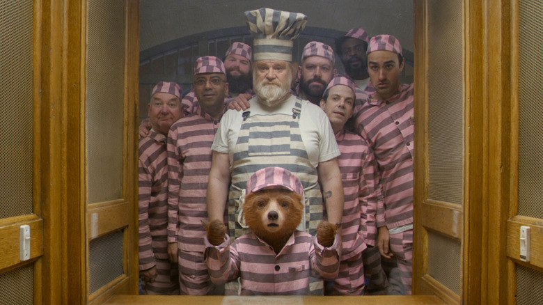 Paddington surrounded by fellow prisoners in Paddington 2