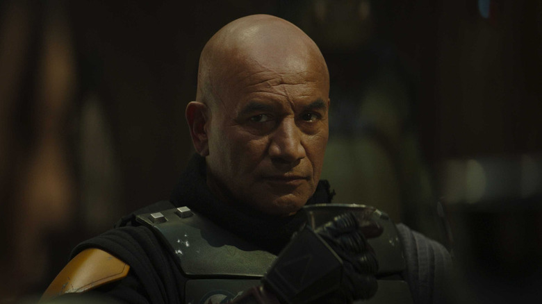 Boba Fett drinking from a metal cup in The Book of Boba Fett (2021)