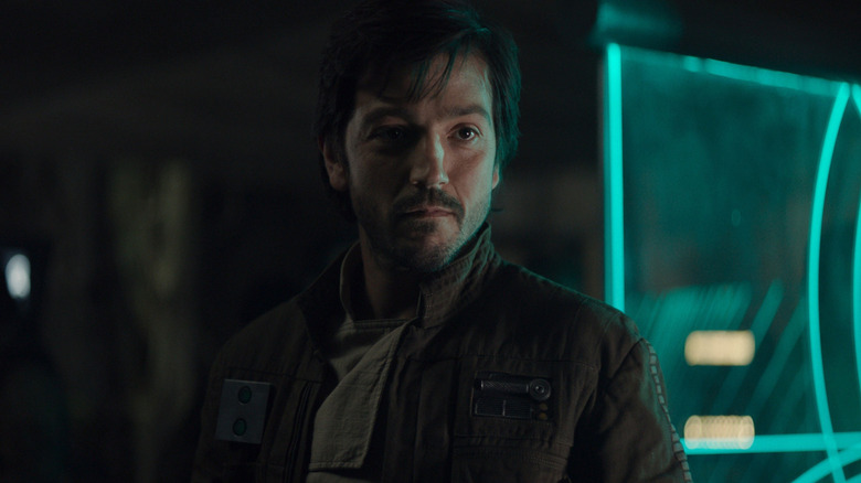 Cassian Andor smiling at the Rebel base on Yavin IV in Rogue One: A Star Wars Story (2016)