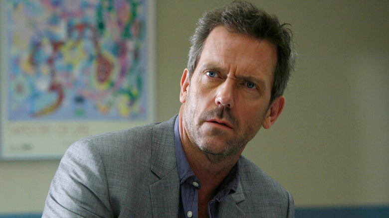 Dr. House sitting in a waiting room