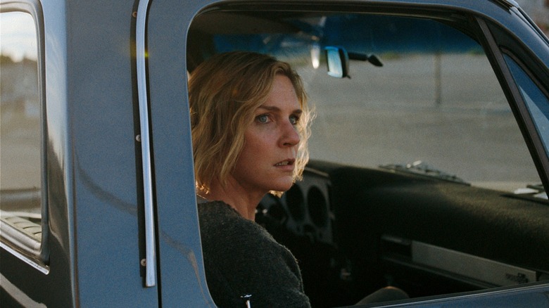 Carol sitting in truck looking upset in Pluribus