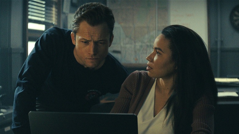 Dave and Michelle reading computer screen in Smoke