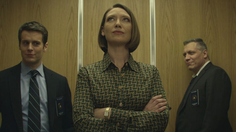 Wendy, Bill, and Holden stand in an elevator in Mindhunter